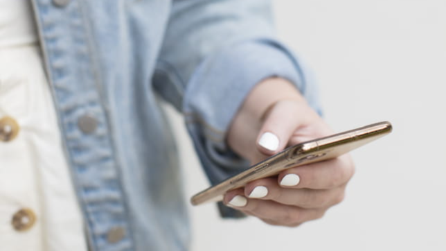 Person holding phone to access the Getting Started Gluten Free eBook