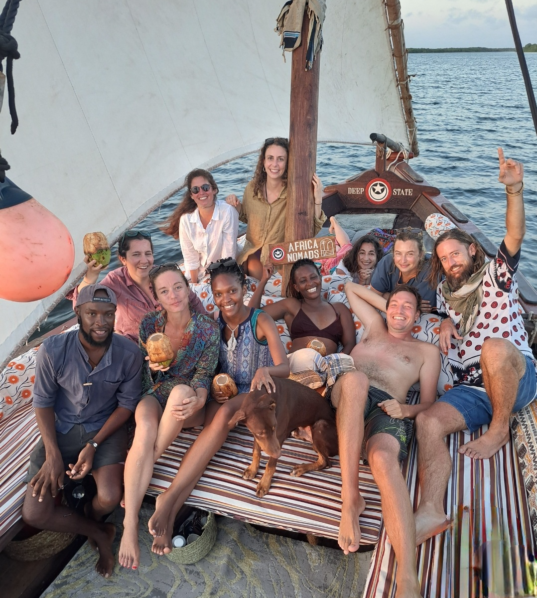 Digital Nomads from AfricaNomads in a traditionally wooden built Swahili dhow in the Lamu Island Retreat in Kenya