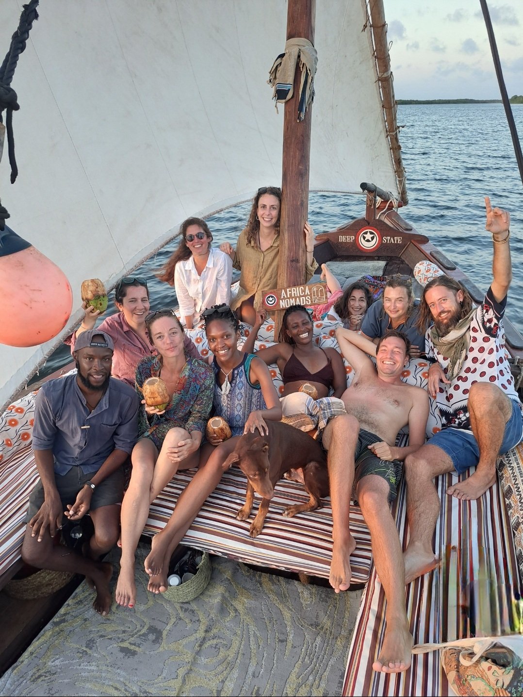 Digital Nomads from AfricaNomads in a traditionally wooden built Swahili dhow in the Lamu Island Retreat in Kenya