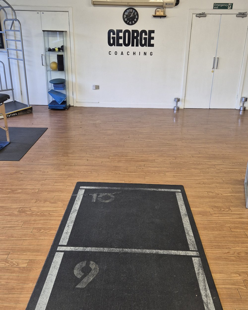 Training mat and the George Coaching wall logo