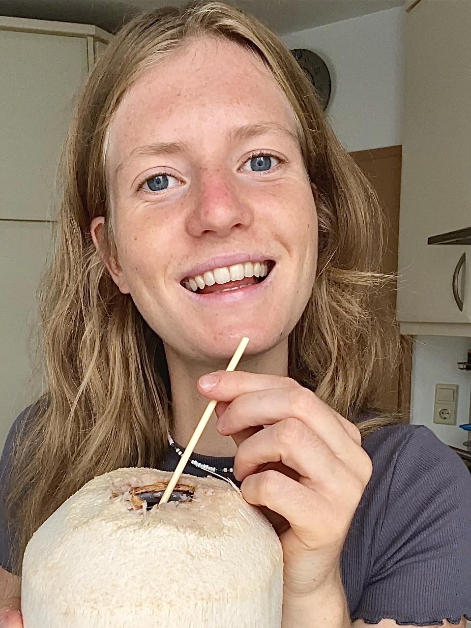 Julia enjoying a fresh coconut