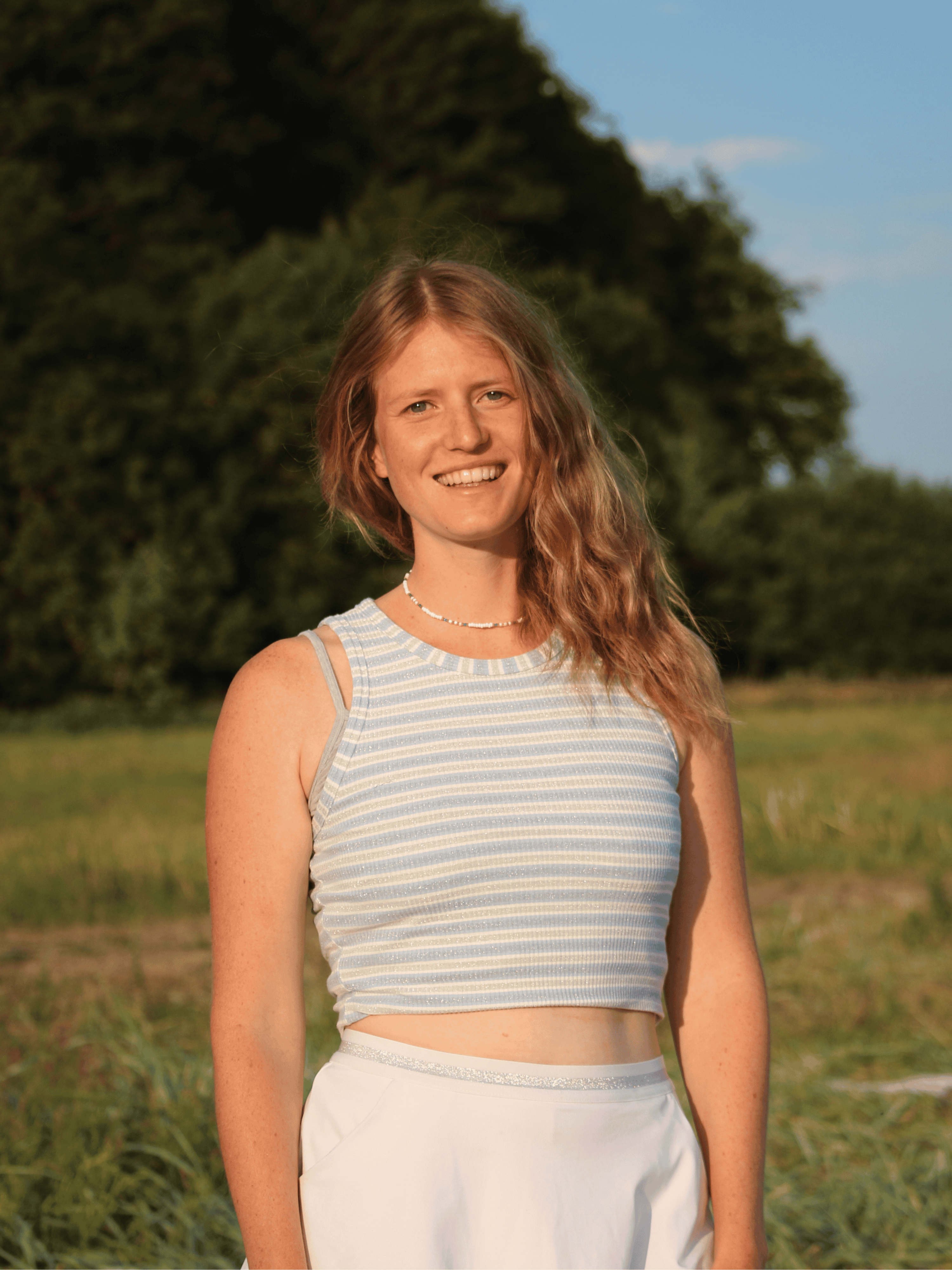 Julia Sana smiling in the evening sun