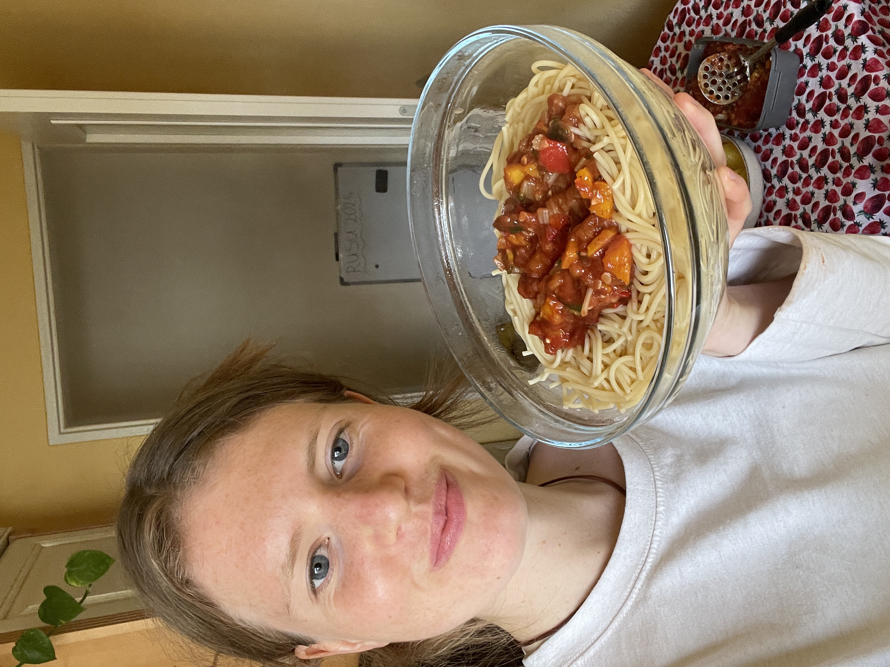 Julia holding spaghetti bolognese