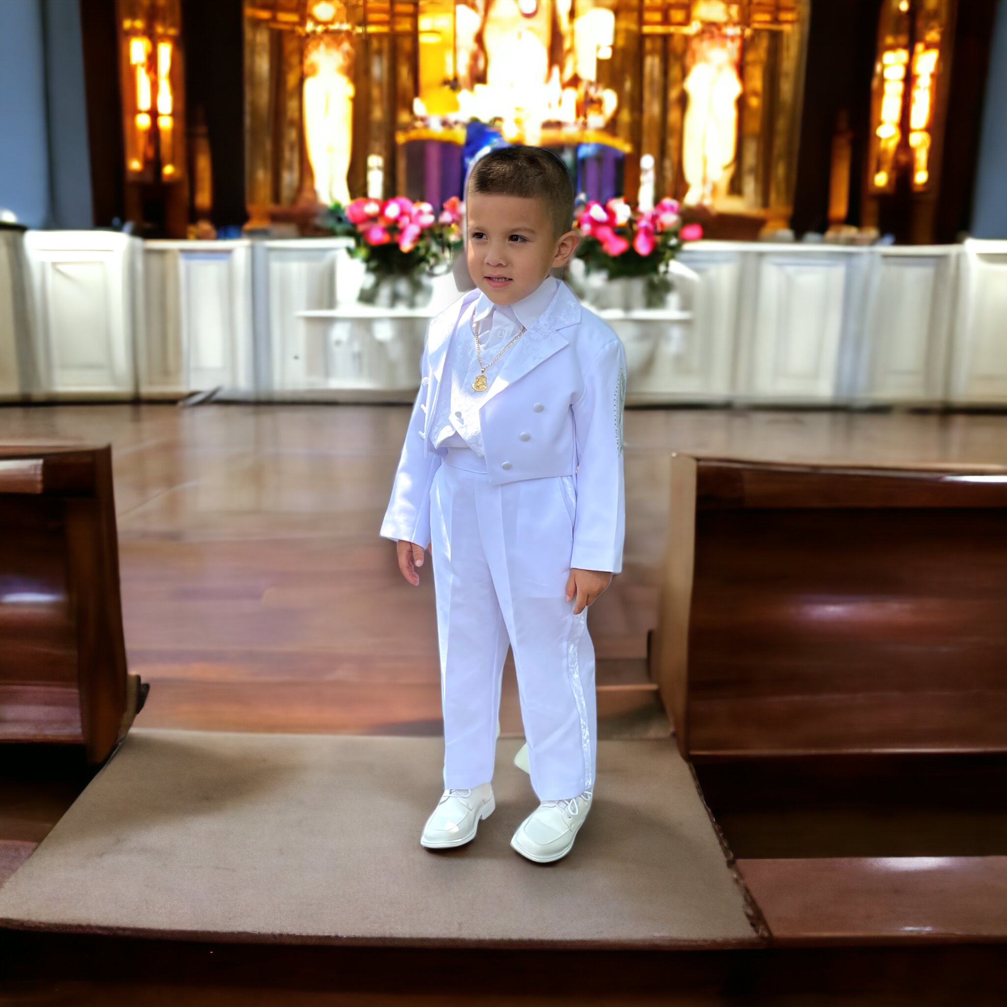 A child in his baptism, standing elegantly with his new chain and Jesus pendant draping from his neck, in awe of his new beginning