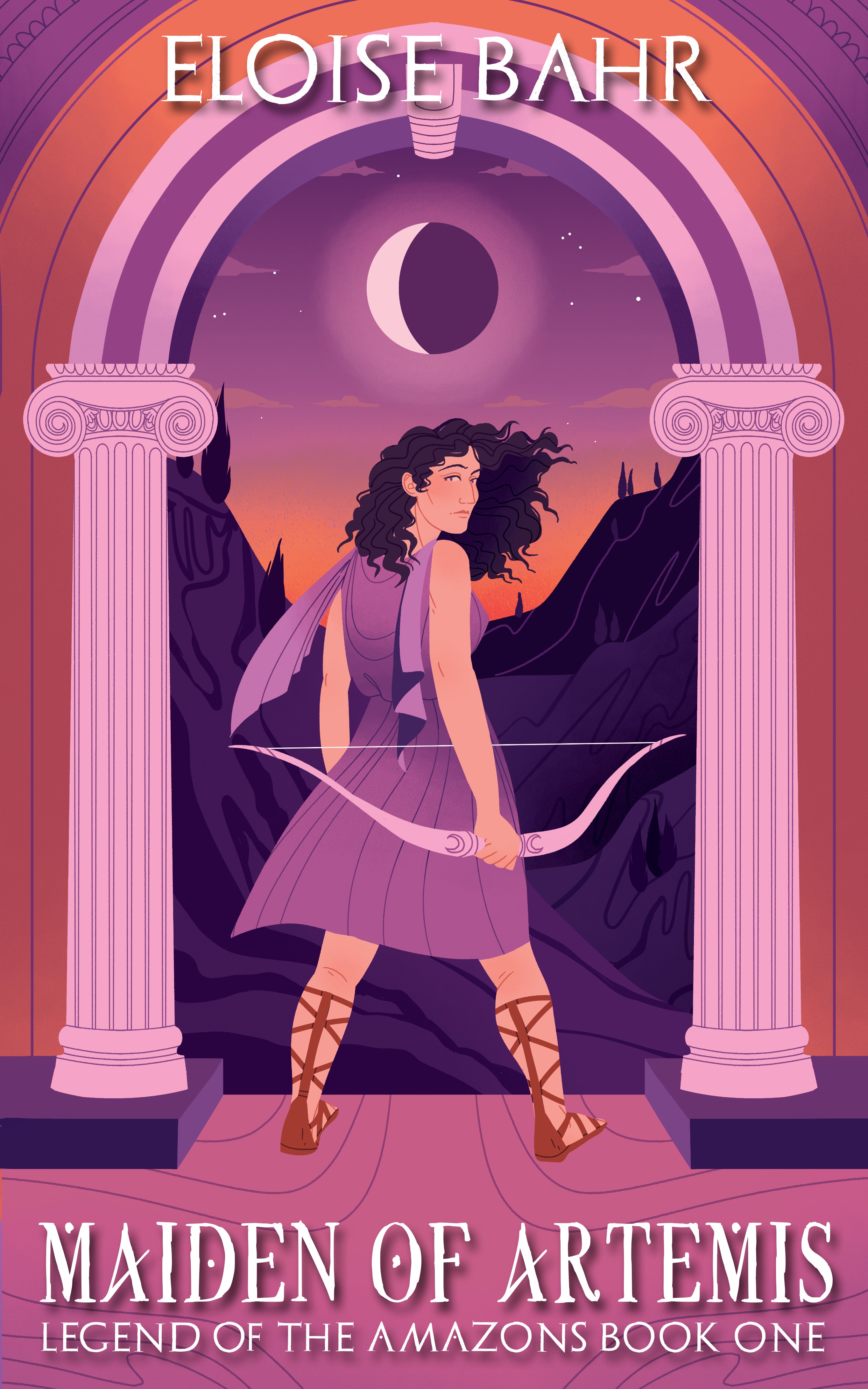 The cover has Ionic Greek columns creating an archway, through which the mountains of Ancient Greece can be seen. The book’s protagonist, Otrera, stands back to the reader but looking over her shoulder, an intense look in her eye as a soft wind blows her curly hair and teases her knee-length tunic. In her right hand she holds an archer’s bow, but there’s noticeably no quiver. Centered above her is a crescent moon. The sun is setting behind the mountains, bathing the entire image in an orange and lilac color scheme. At the top of the cover is the author’s name. At the bottom is Maiden of Artemis in an ancient looking font. Below that is Legend of the Amazons: Book 1