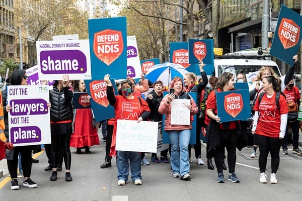 A group of advocates from Every Australian Counts holding signs that say 