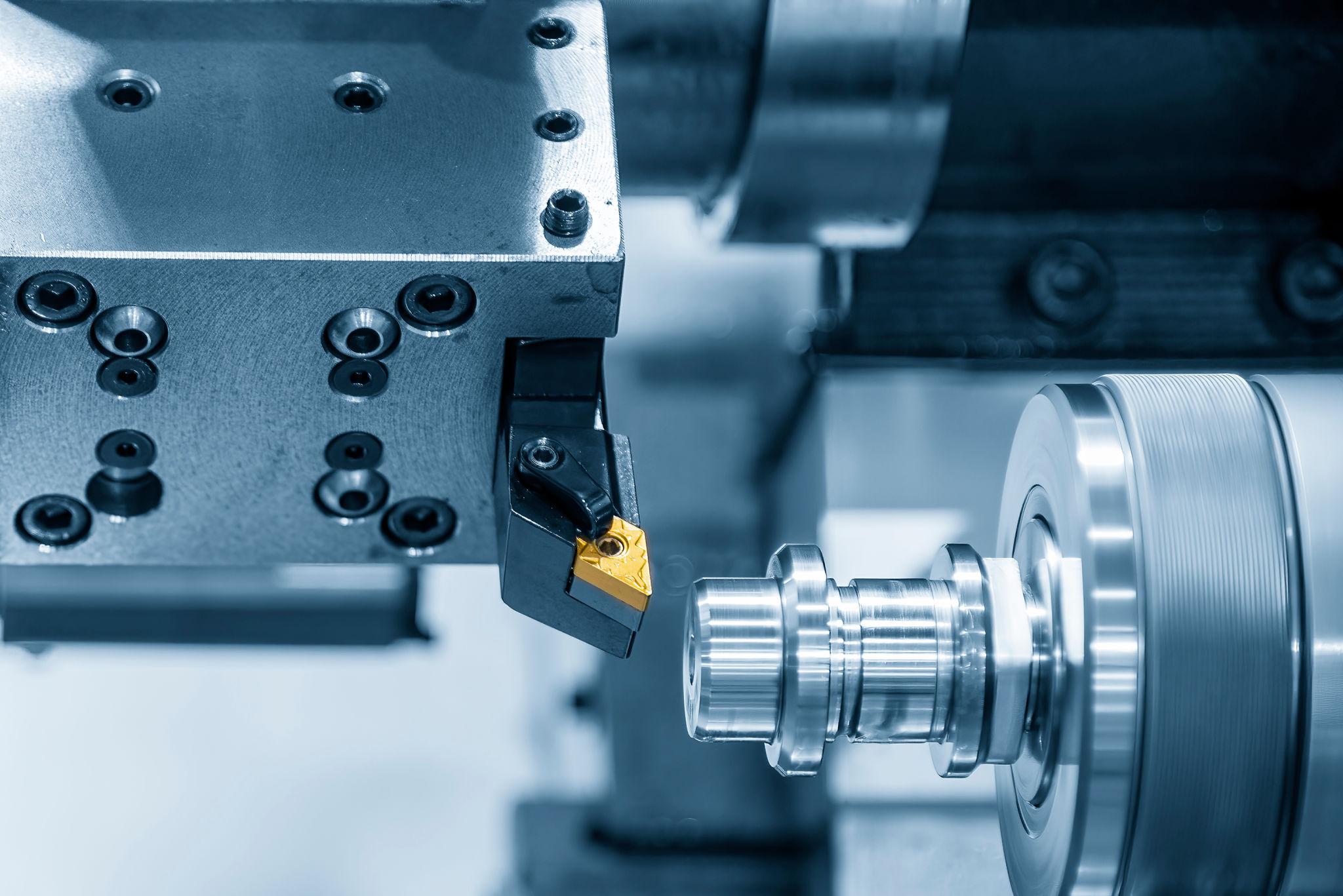 Fastcut center drive lathe performing Face and Center machining on a steel shaft blank