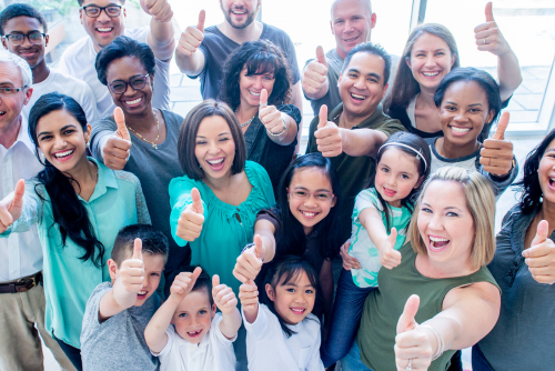 diverse group of happy people with thumbs up