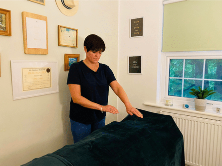 reiki master amy orsini performing reiki on a client - three little birds