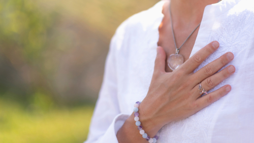 spiritual lady holding hand on heart