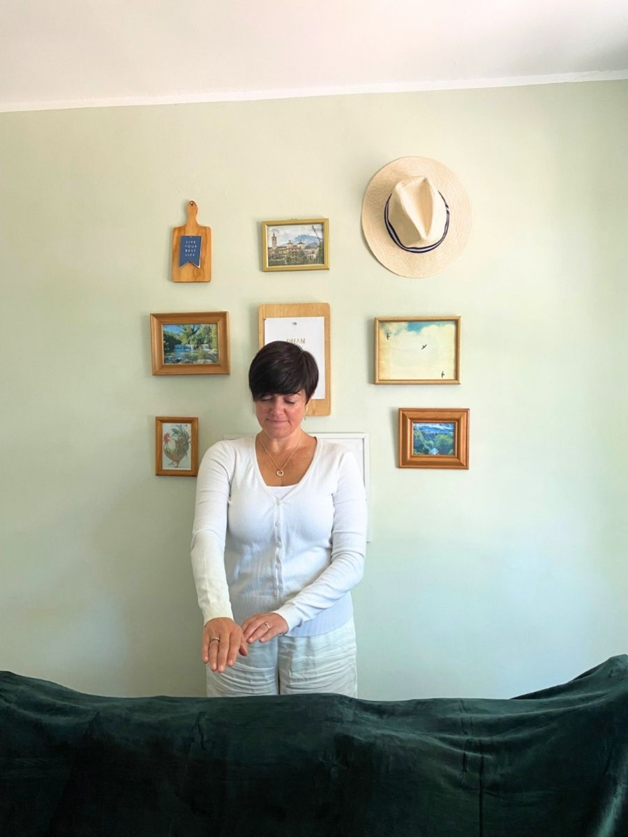 reiki master amy orsini performing reiki on a client - three little birds