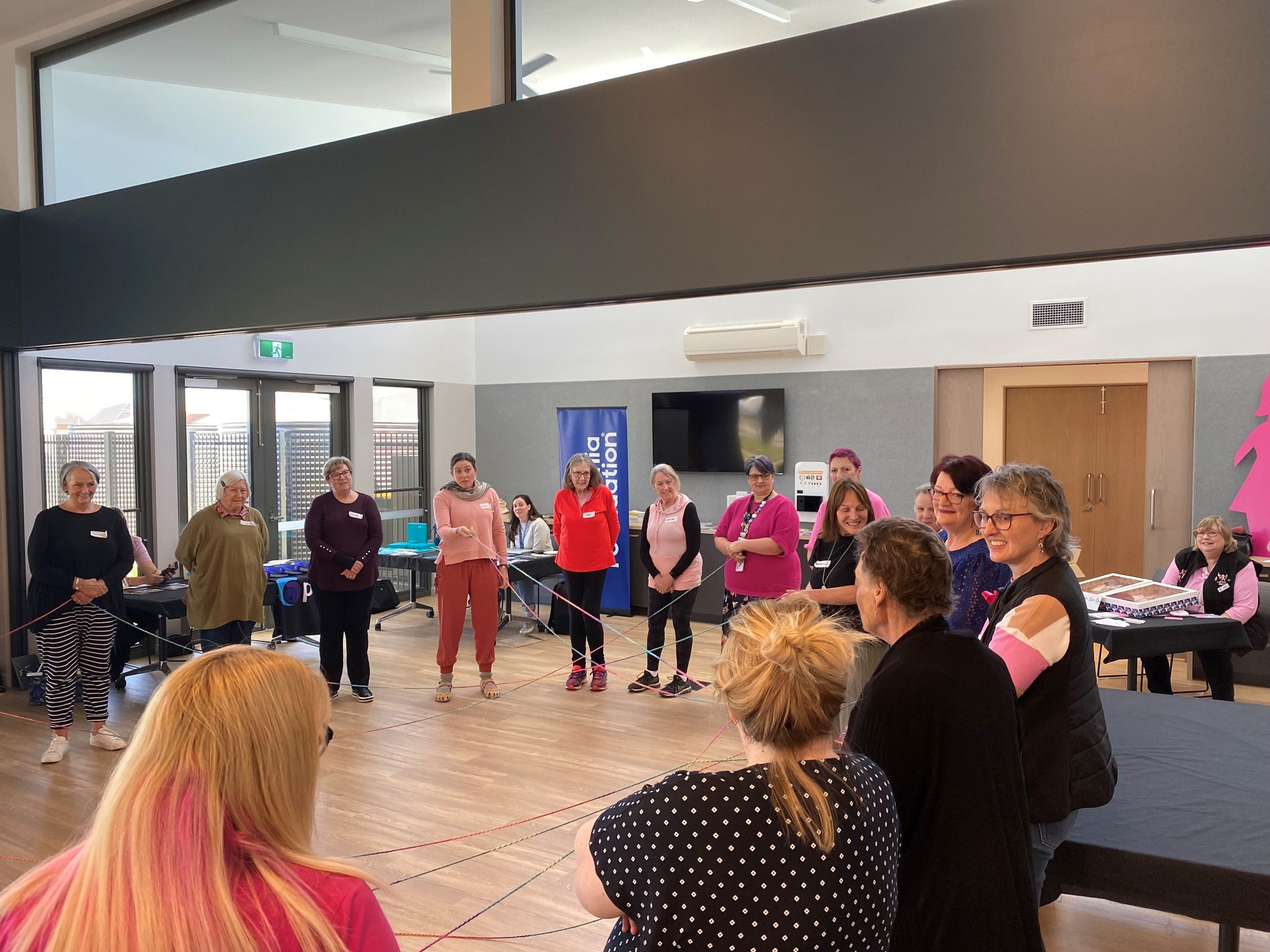 Fiona Hocking facilitating a group art therapy activity at a Counterpart Women's Health Wellbeing Day in Ballarat