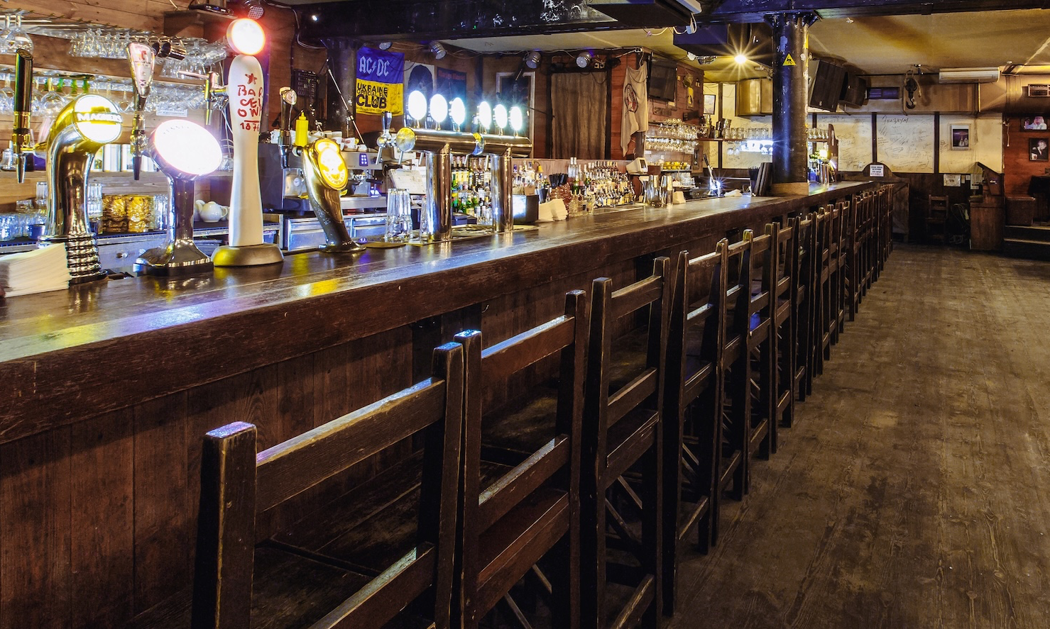 Image of Bryant's Bar inside:  long bar with bar chairs