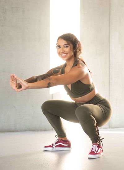 Personal trainer, Sasha Lukaszczyk, demonstrating proper squat