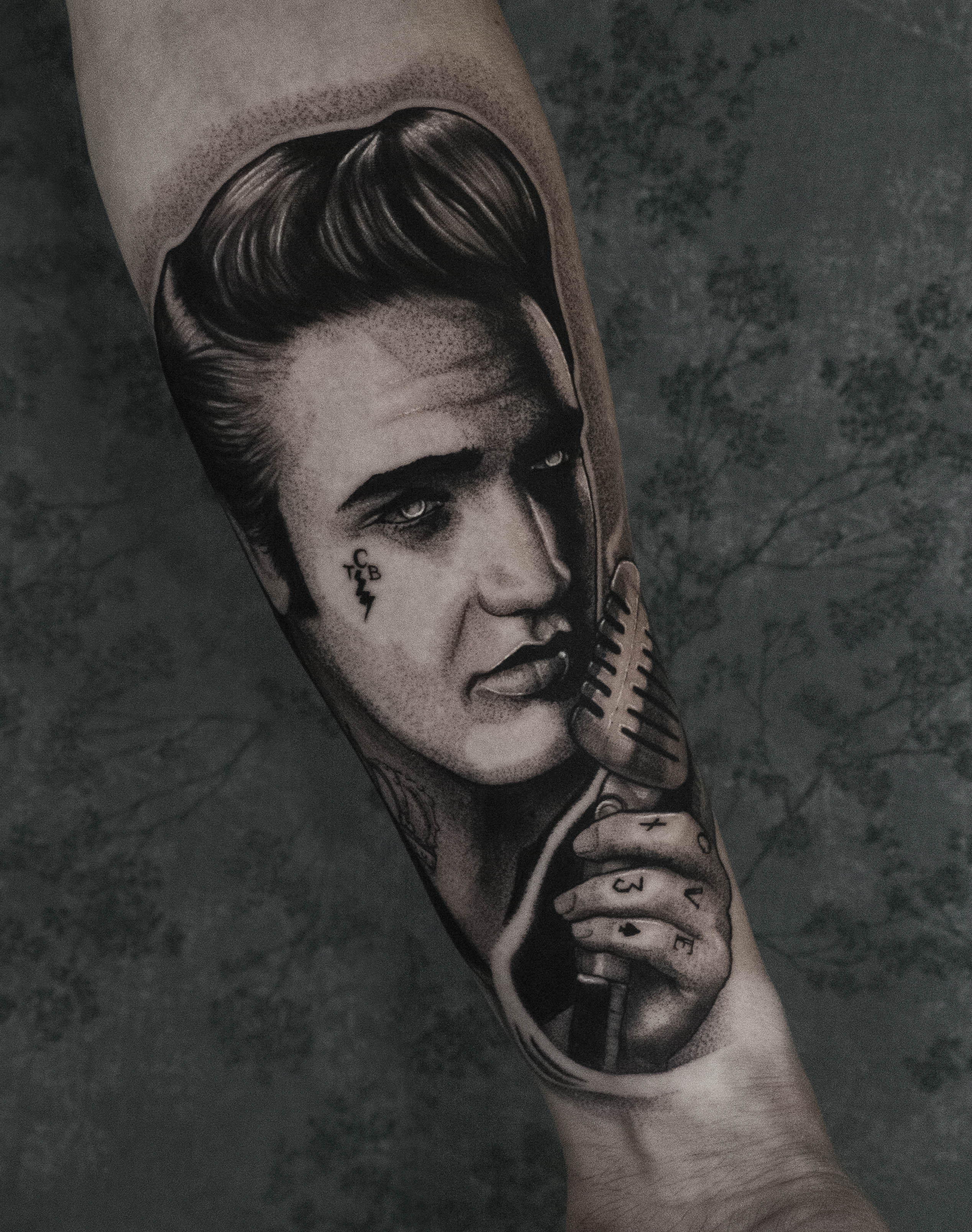 Dark portrait of Elvis Presley done by Joe Sinner
