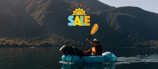 Man paddling packraft after shopping the Summer Sale