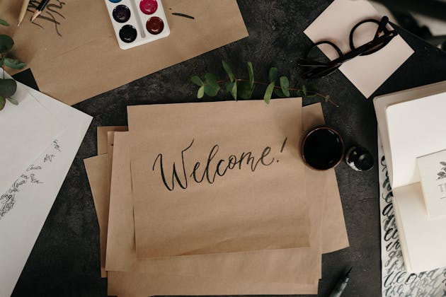 Image with a brown paper square in the middle of the picture with the word