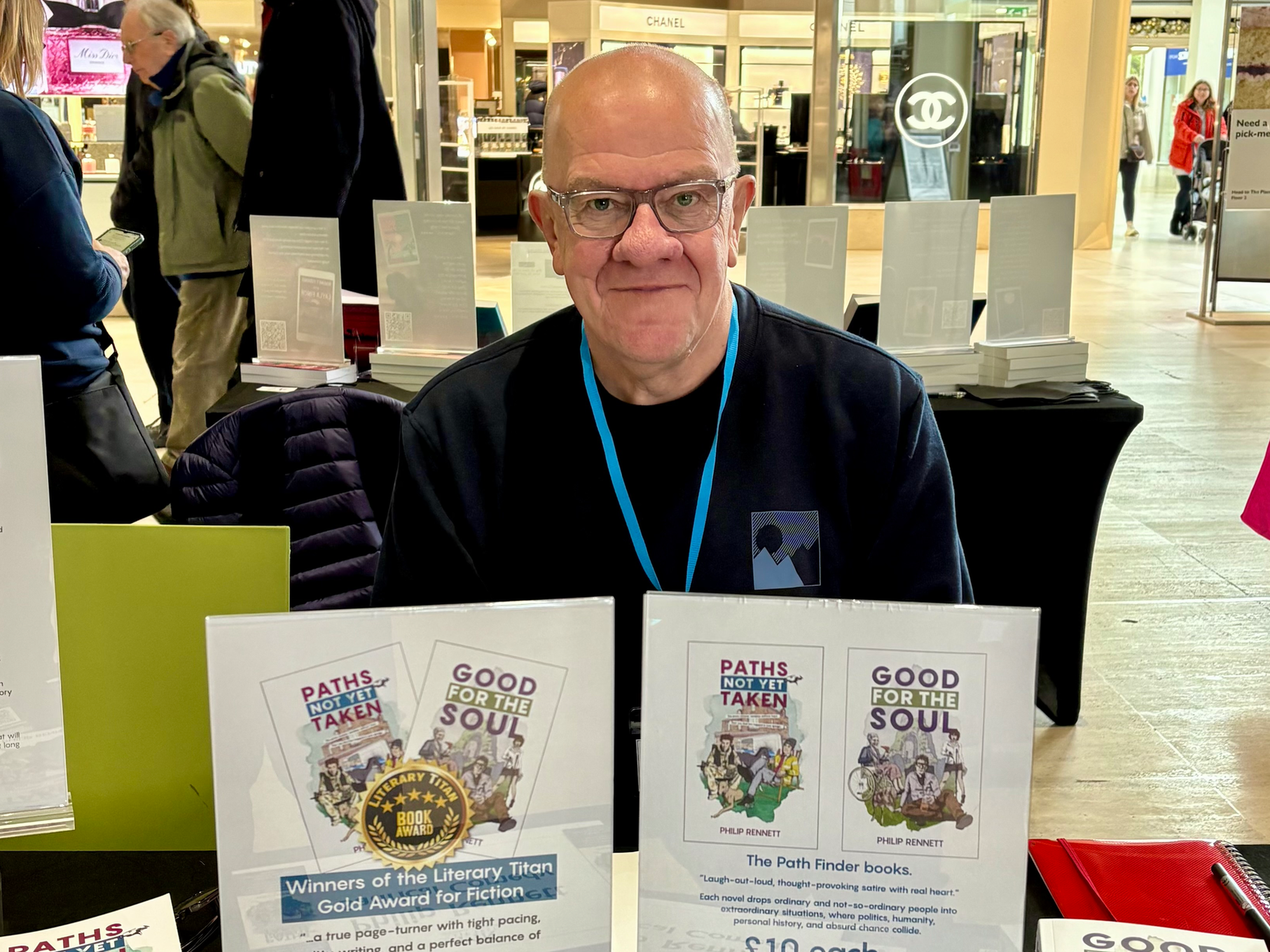 Author Philip Rennett behind his display table at the Milton Keynes Indie Book Fair 2025