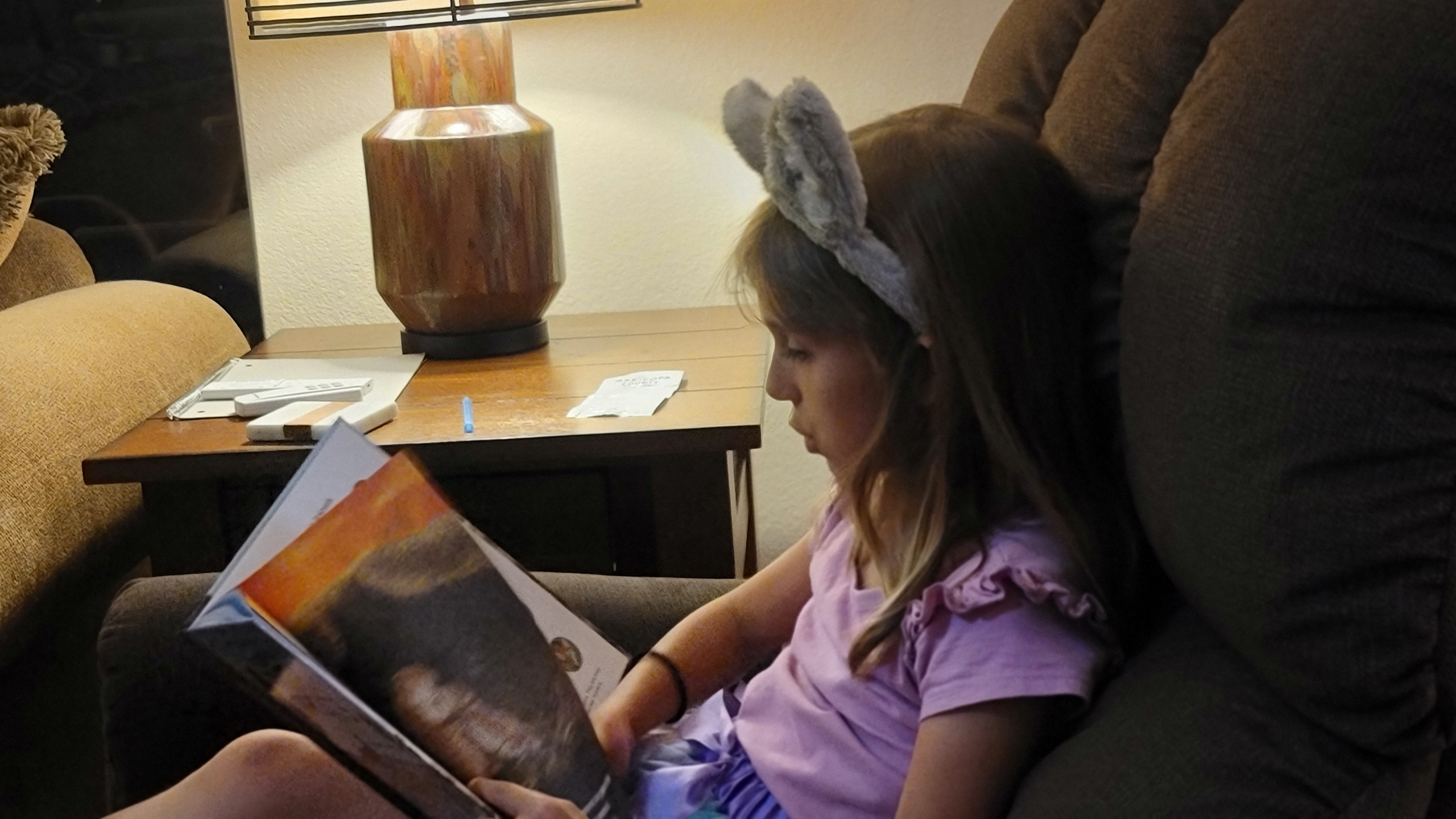 A little girl reading a book