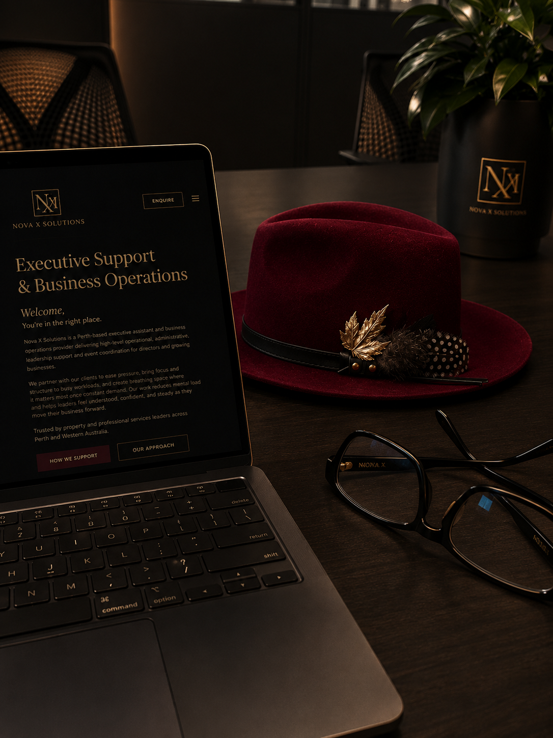 Woman's hands typing on laptop in luxury setting