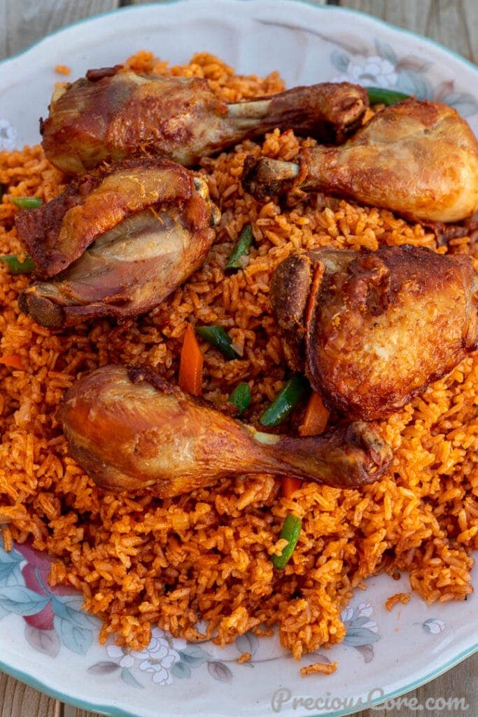 Jollof Rice With Chicken on a Serving Platter.