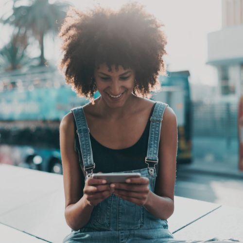 Woman reading PeriHub newsletter