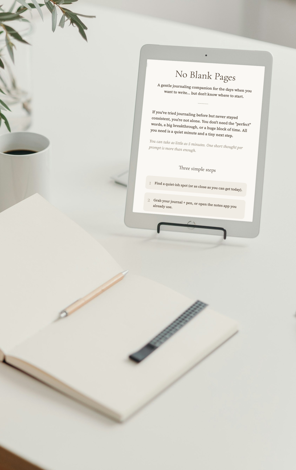 No Blank Pages journaling prompt tool shown on screen beside an open journal and coffee