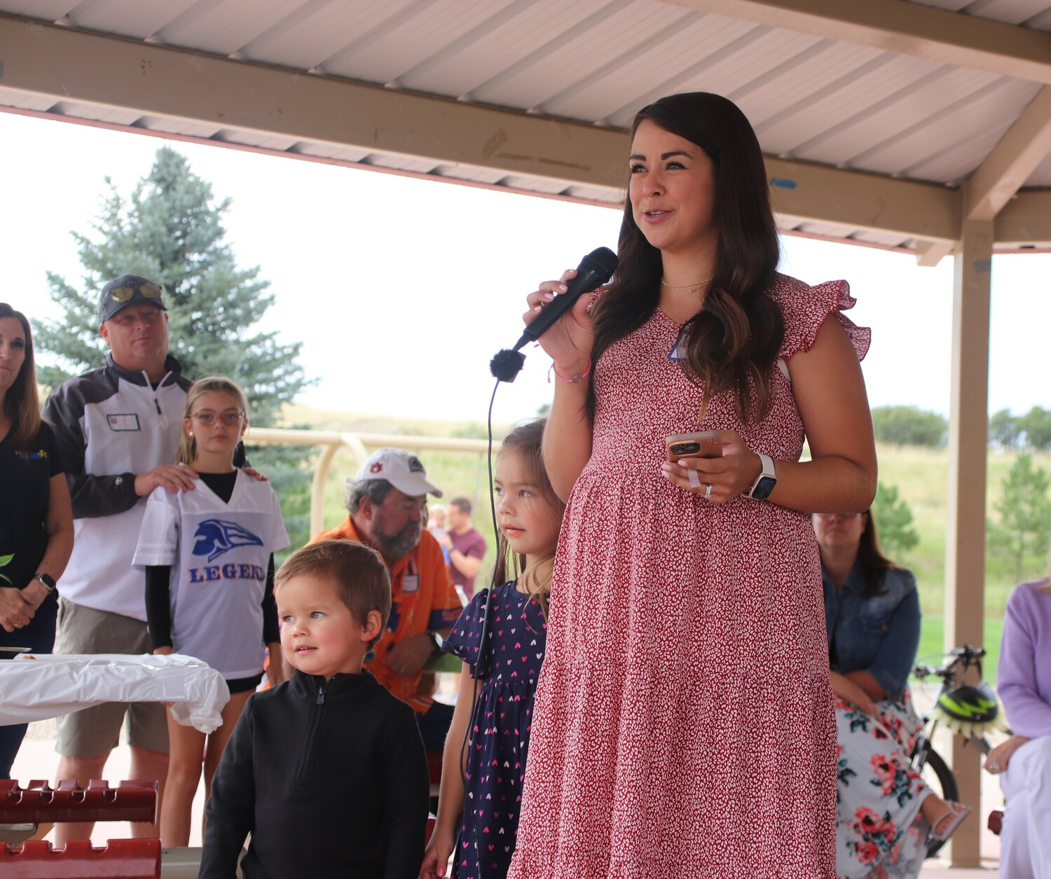 Lenaya Dotseth, a Sterling Ranch resident, speaks at the Invest in DCSD campaign kick off on Aug. 13 while her children, Everly and Cohen, offer support. The Douglas County School District is asking voters to approve funding for new schools and more competitive staff pay. PHOTO BY MCKENNA HARFORD