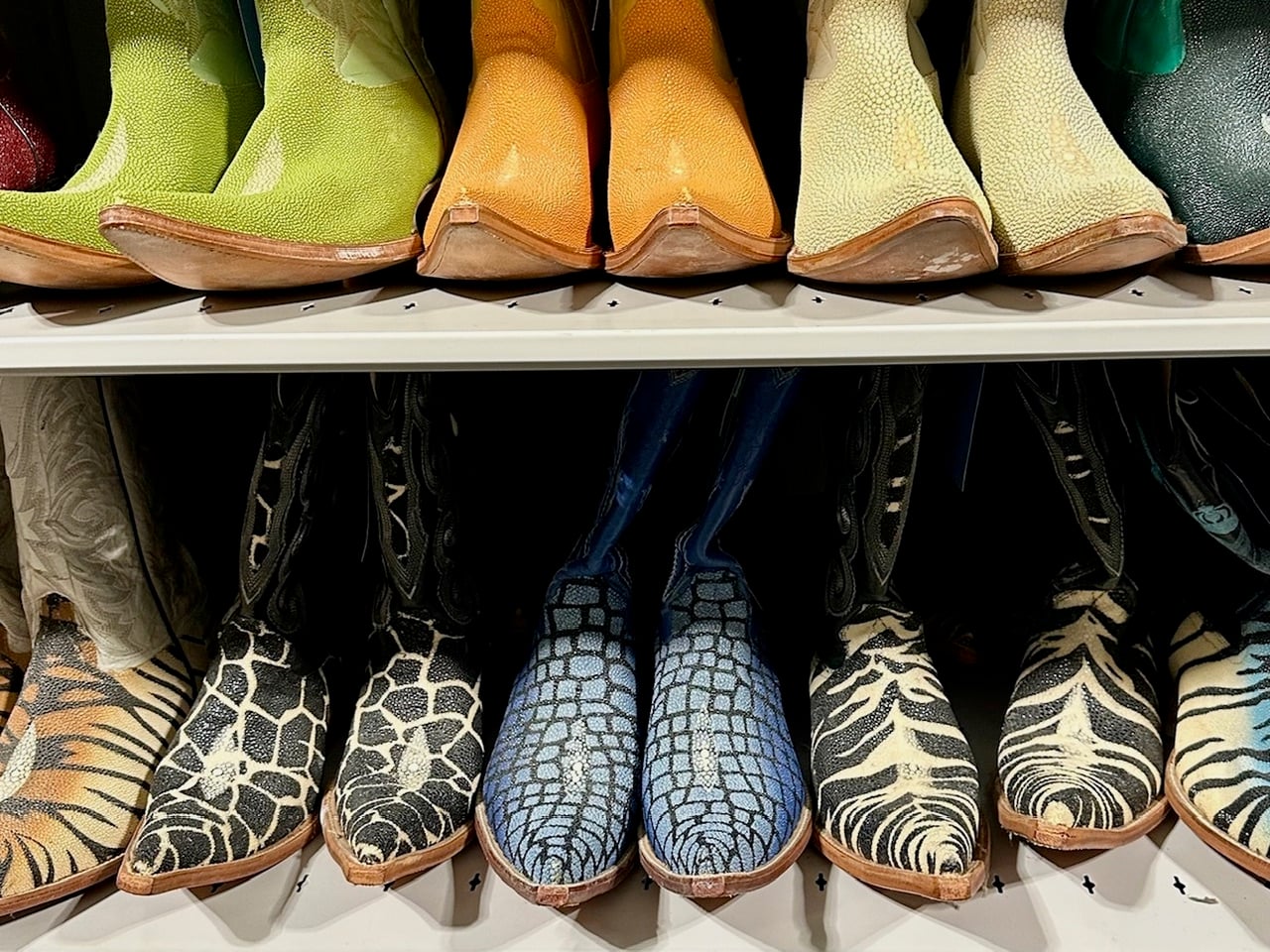 colorful cowboy boots made of leather that looks like water drops