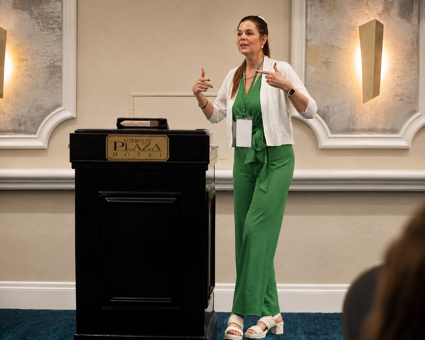 Coach Carole speaking at a live event